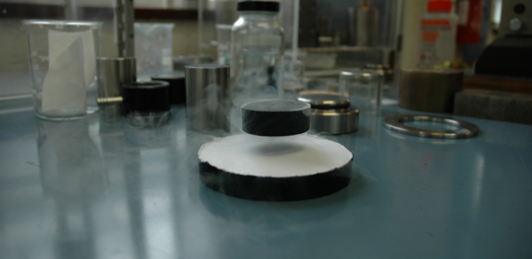 A bulk superconductor levitated by a permanent magnet 
