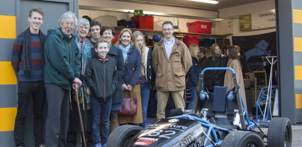 The Oatley family in front of the garage