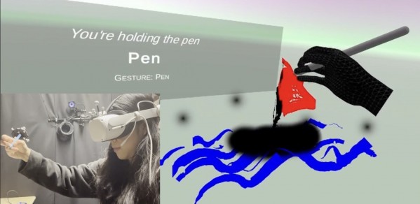 Yi Chen Hock drawing in the Virtual Reality drawing application she developed using hand gesture recognition with an OptiTracked Pen