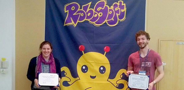 Engineering PhD students Josie Hughes and Kieran Gilday with their certificates.
