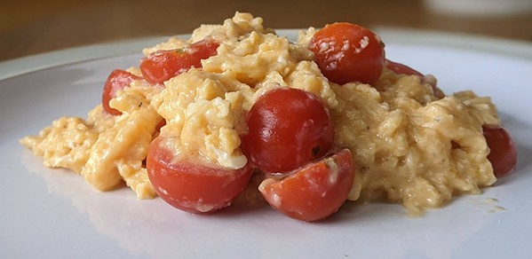 Eggs and tomatoes made by a human cook
