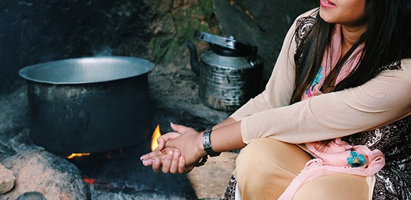 Nepali girl preparing meal.