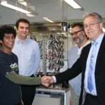 PhD student Sapuma Jaliya Senanayaka (second from left) shakes hands with Michell’s Technical Director, Andrew Stokes