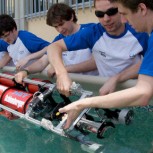 The team lowers Red Herring into the salt-water ballasting tank provided by the Nato underwater research center in Italy