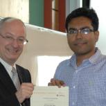 Mash-Hud Iqbal receiving the Certificate in Enterprise with distinction from Professor Arnoud De Meyer