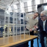 Professor Gary Hunt (left) with Sir James Dyson discussing a model of the James Dyson Building