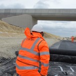 Epsimon's technicians installing Sensorgrid, a fibre-optic instrumented geogrid for early detection of sub-surface ground moveme