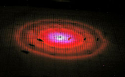 A photograph of the far field diffraction rings of the liquid crystal laser emission.