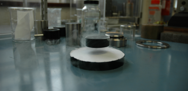 A bulk superconductor levitated by a permanent magnet