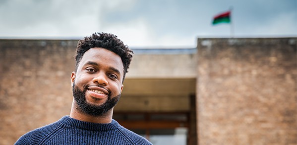 Osarenkhoe with the pan-African flag