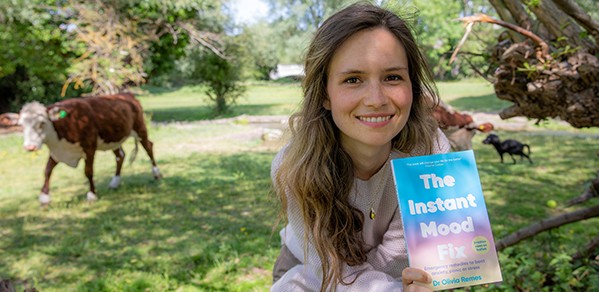 Dr Olivia Remes with a copy of her new book, The Instant Mood Fix, which is based on science.