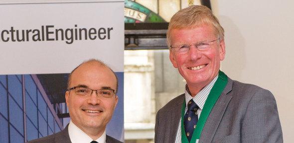 Dr Mauro Overend (left) receiving the Guthrie Brown Medal from Professor Roger Plank