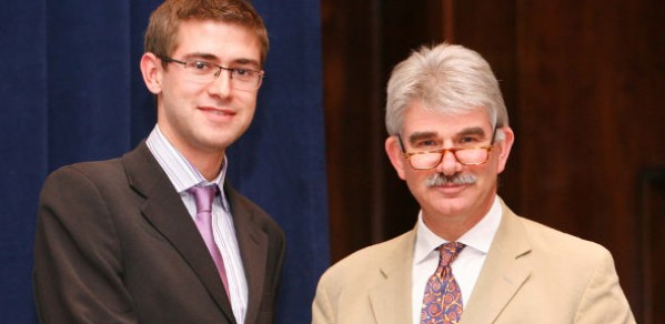 Andrew Jackson (left) receiving his prize certificate from ICE Director General Tom Foulkes