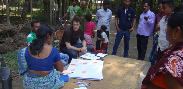 Duncan (centre) helps to interview community operators managing arsenic removal filters in West Bengal, India, as part of his PhD research.