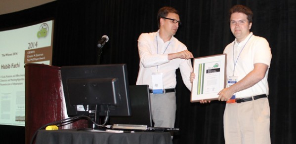 Dr Brilakis receiving the Eastman award on behalf of Dr Fathi