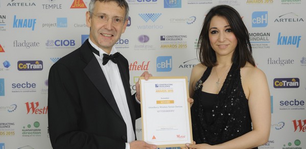 Heba Bevan, right, is presented the award from Nigel Blacklock, Head of Technical at Sika
