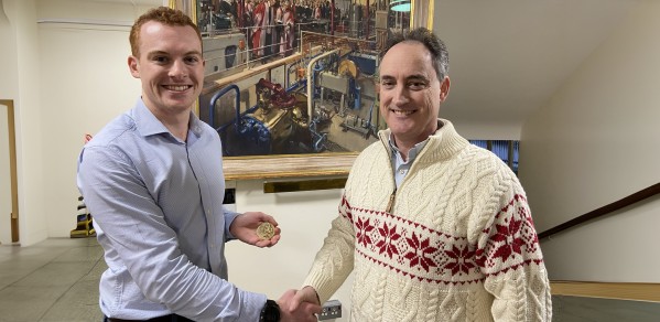 James Lazenby left receiving the Helios Prize Medal from Professor Colm Durkan