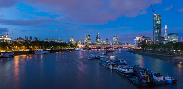 The skyline of London viewed along the Thames from Waterloo Bridge in London, England. 