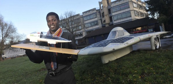 Keno with CUER solar car 'Endeavour' and a model of 'Evolution'