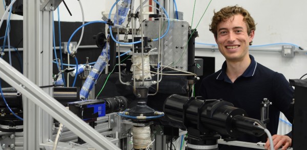 Dante McGrath with the experimental setup used throughout his PhD at the Hopkinson Laboratory to examine droplet-laden laminar flames.