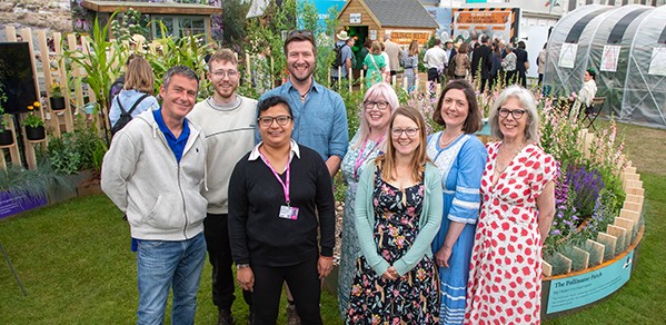Pictured in front of the Cambridge exhibit are, back row, from left, Kynan Wright and Thomas Glenday (Engineering); Kathy Grube (Sainsbury Laboratory). Front row, from left, Dan Boutell (Engineering)