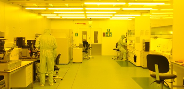 Researchers working in a cleanroom