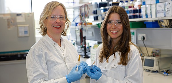 Professor Róisín Owens (CEB), left, with Dr Amparo Güemes Gonzalez (Department of Engineering), each holding the miniature devices they have created