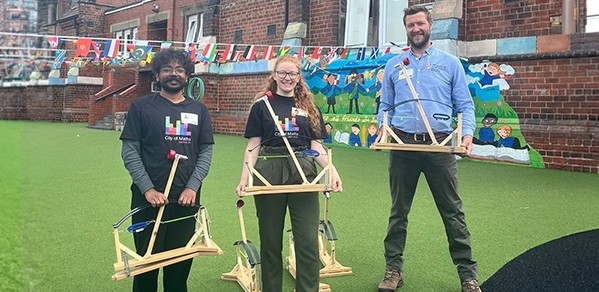From left, Revanth Taneeru and Dr Rebecca Chadwick (both City of Maths Ambassadors) and Thomas Glenday (Head of Design and Technical Services) with small-scale replicas of the historic machine