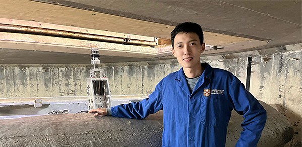 Zhijun by the beam centrifuge in the Schofield Centre