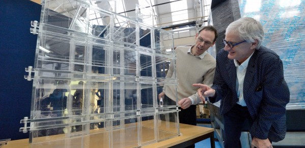 Professor Gary Hunt (left) with Sir James Dyson discussing the model of the James Dyson Building