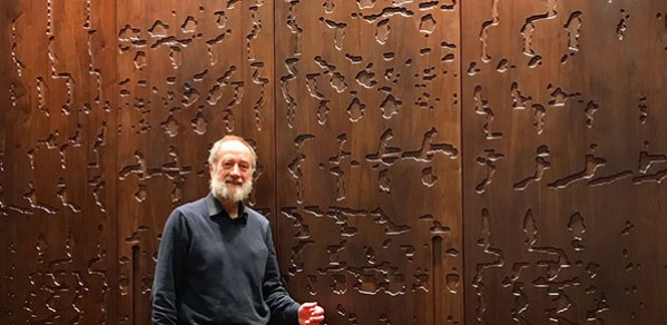 Professor Jim Woodhouse in front of the doors of the Ark which carry his spectrogram design.