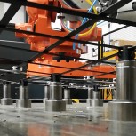 a modular “pin-bed” solution that uses an array of computer-controlled pistons (actuators) that move vertically to support and d