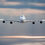 passenger airplane in the clouds