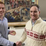 James Lazenby left receiving the Helios Prize Medal from Professor Colm Durkan