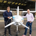 Dr Deepanshu Singh (AIA) and Eliot Whittington (CISL) are seen standing either side of the Pipistrel Velis Electro airplane