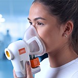 A head and shoulders shot of Billy Boyle. Pictured next to him is a woman using the Breath Biopsy® platform 