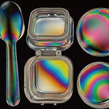Birefringence of plastic products in the lab set against a black background