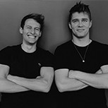 A black and white head and shoulders shot of Wordware co-founders Robert Chandler and Filip Kozera. Both are standing in a relax