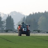 Tractor spraying fertiliser