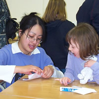 Sheenaanne Law helps with a complex folding operation