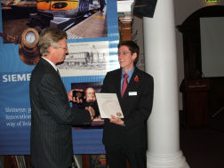 Neill Campbell receives the Siemens Medal from Alan Wood, CEO of Siemens plc