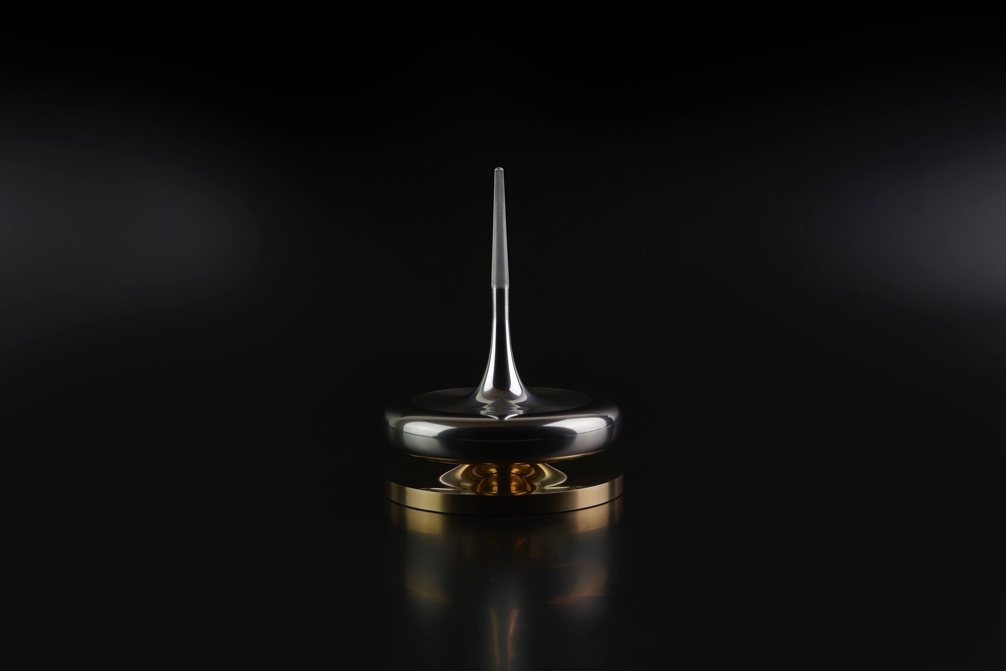 A spinning top designed and produced by James Goh
