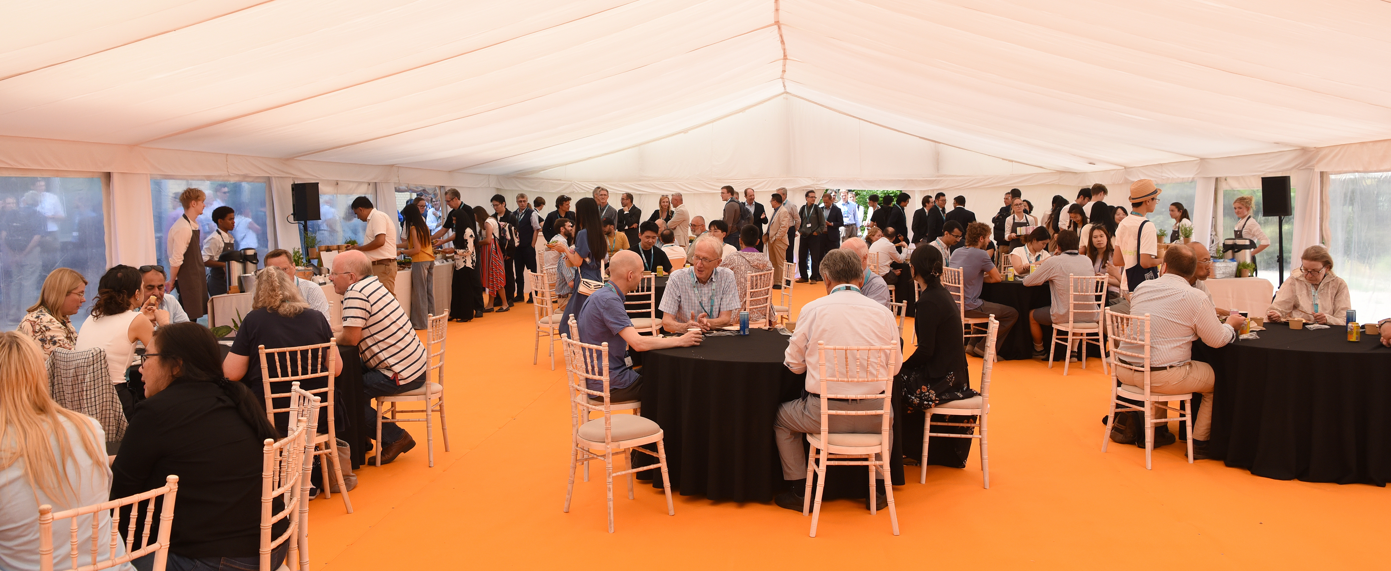Attendees at the CGC and EE Anniversary Event 2026 mingle and chat.