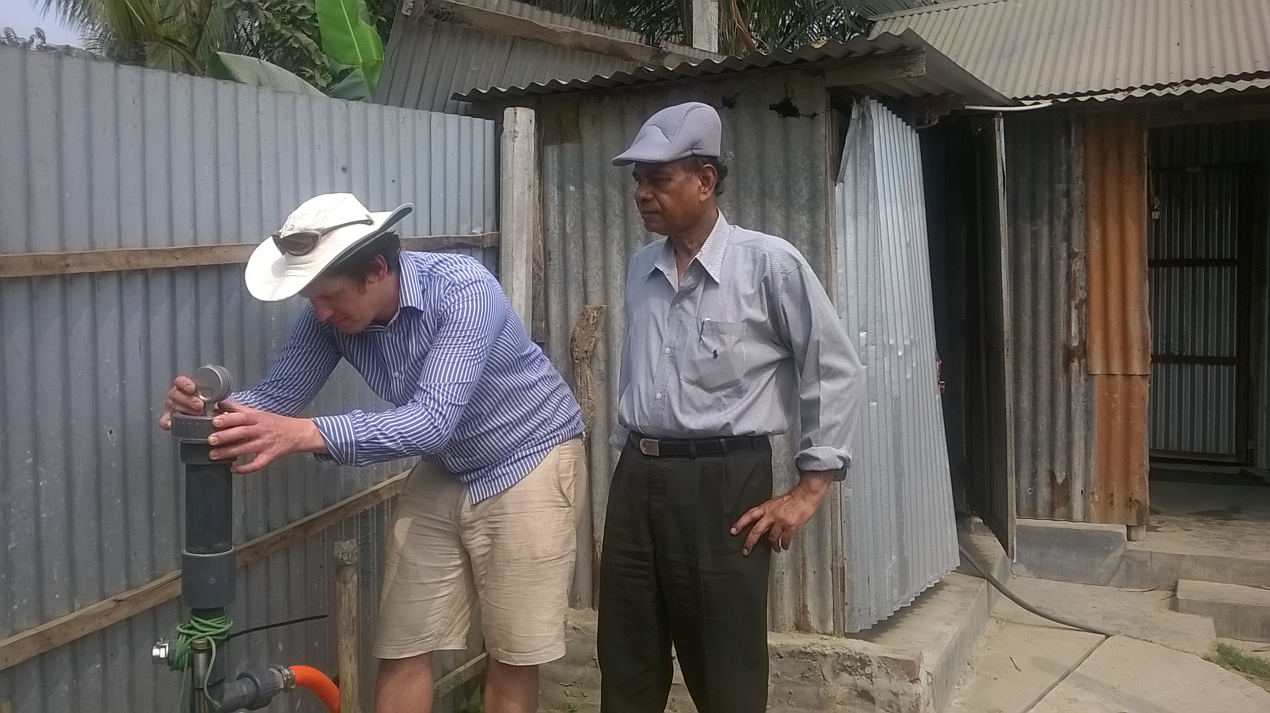 Tom checking the drive pressure on a recently-installed Joukowski-effect pump prototype in Dhaka